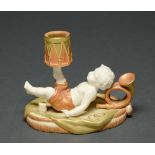 A Royal Worcester boy and drum hand candlestick, 1906, decorated in apricot, green and gilt