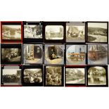 A collection of 60 x 30mm glass stereo photographs, c1920-30, a box of early 20th c magic lantern