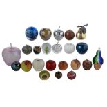 A collection of glass, wood and stone paperweights, mostly in the form of an apple, 20th c,