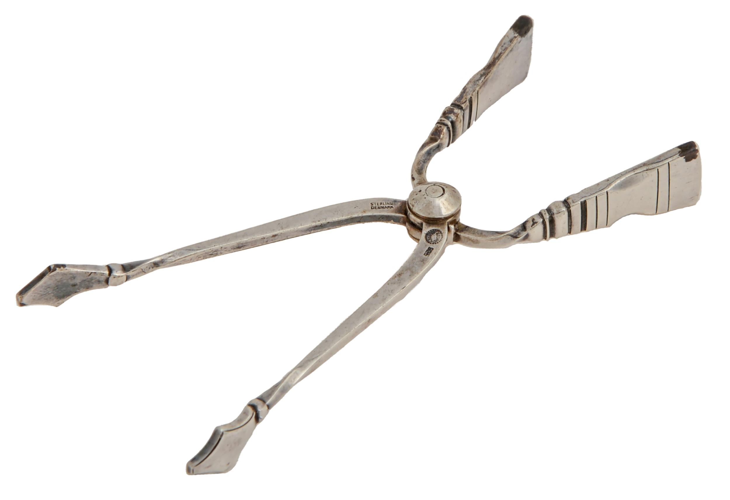 Georg Jensen. A pair of Danish silver spring action sugar tongs, post 1945, maker's marks, 19dwts,