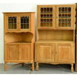 A light oak bookcase and a corner cupboard with leaded glass doors, late 20th c, the lower part of