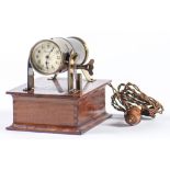 A brass and mahogany battery illuminated night projection timepiece, Harrods Ltd London, early