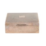 An Elizabeth II silver cigarette box, the lid engine turned, cedar lined, 11cm l, marks rubbed, by