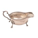 An Elizabeth II silver sauceboat, with gadrooned rim, on three hoof feet, 16.5cm l, by Elkington &