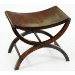 A George III mahogany X-frame stool, with dished solid rectangular seat, the frame united by rod