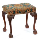 A mahogany stool, early 20th c,Â  in George II style, on carved cabriole legs and claw-and-ball