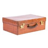 A crocodile hide dressing case, early 20th c, marked on gilt brass locks Finnegans Ltd London,