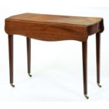 A George III mahogany Pembroke table, the serpentine top on square tapered legs and brass castors,