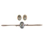 An aquamarine and diamond bar brooch, millegrain set in gold and a pair of aquamarine ear studs in