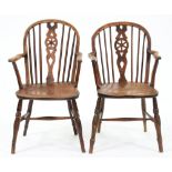 Two Victorian ash Windsor chairs, Thames Valley region, with wheel splat and elm seat, one with