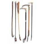 Six various wood or stitched leather covered riding crops, one by Swaine & Adeney, all first half