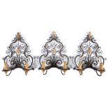 A set of three wrought iron wall sconces, 20th c, in early 18th c style, partly gold painted, 42cm h