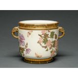 A Royal Worcester elephant handled jardiniere, 1883, decorated with butterflies amidst flowering