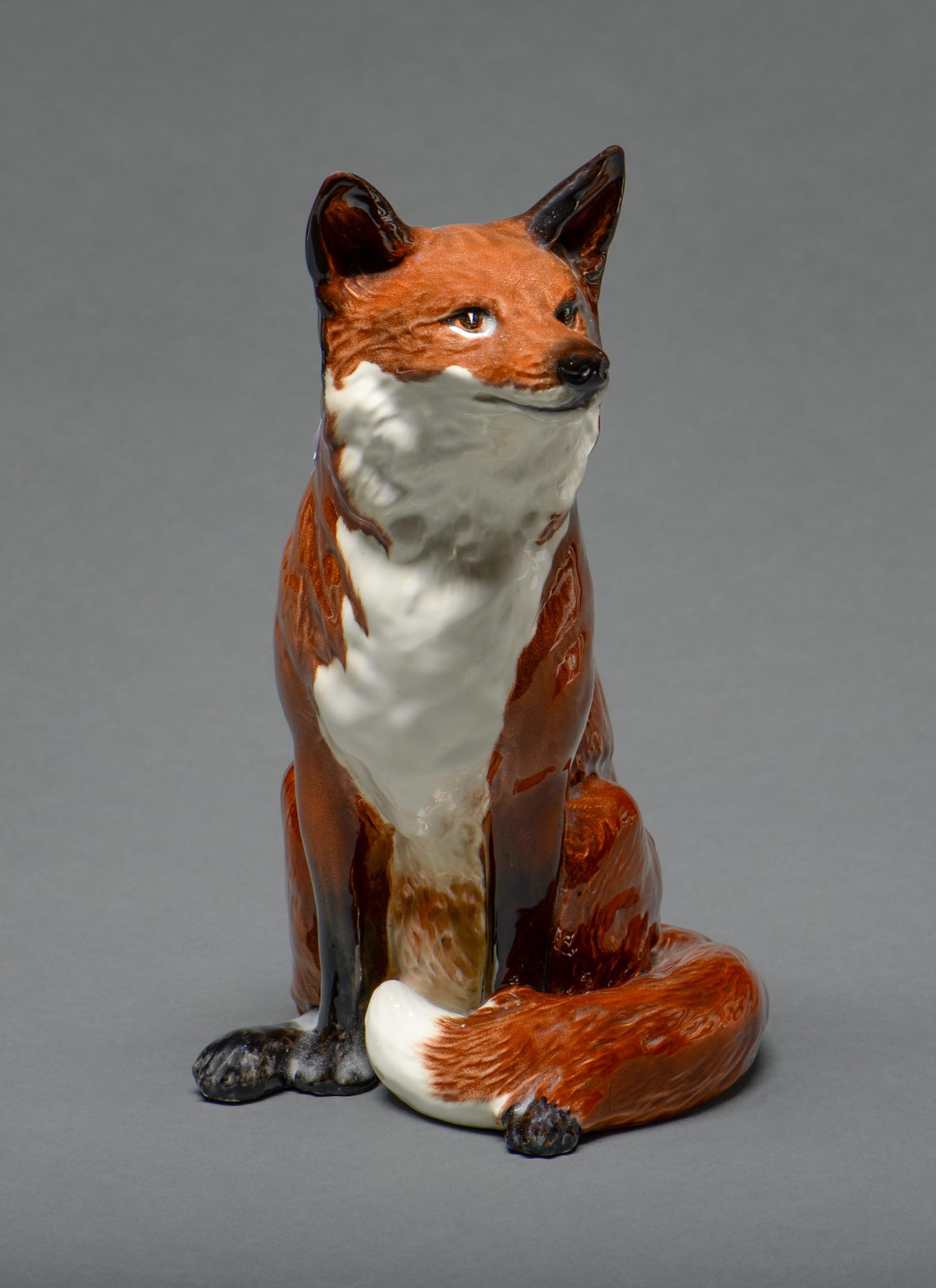 A Beswick model of a fox, 31cm h, impressed mark and 23 ** ConditionGood condition
