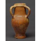 A German saltglazed stoneware three handled jug, 17th / 18th c, 28cm h Neck broken and neatly re-