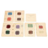 Needlework. An album of darning squares, c1930, worked in coloured wool on gauze with different