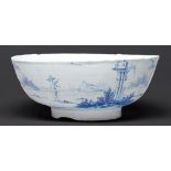 An English delftware punch bowl, London, c1750-60, painted to the exterior with a continuous