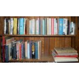 Four shelves of books, including art reference, ceramics, glass, silver and metalware, fine art