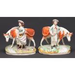 A pair of Staffordshire earthenware figures of a farmer and milkmaid and cows, late 19th c, 17cm h