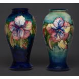 Two Moorcroft Hibiscus vases, mid 20th c, 26cm h, impressed marks, painted initials Good