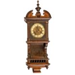 A German architectural stained walnut wall clock, c1900, 69cm h Basically complete but with loss