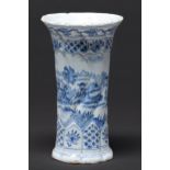 A Dutch delftware spirally lobed sleeve vase, late 18th c, painted with a seated figure in a rural