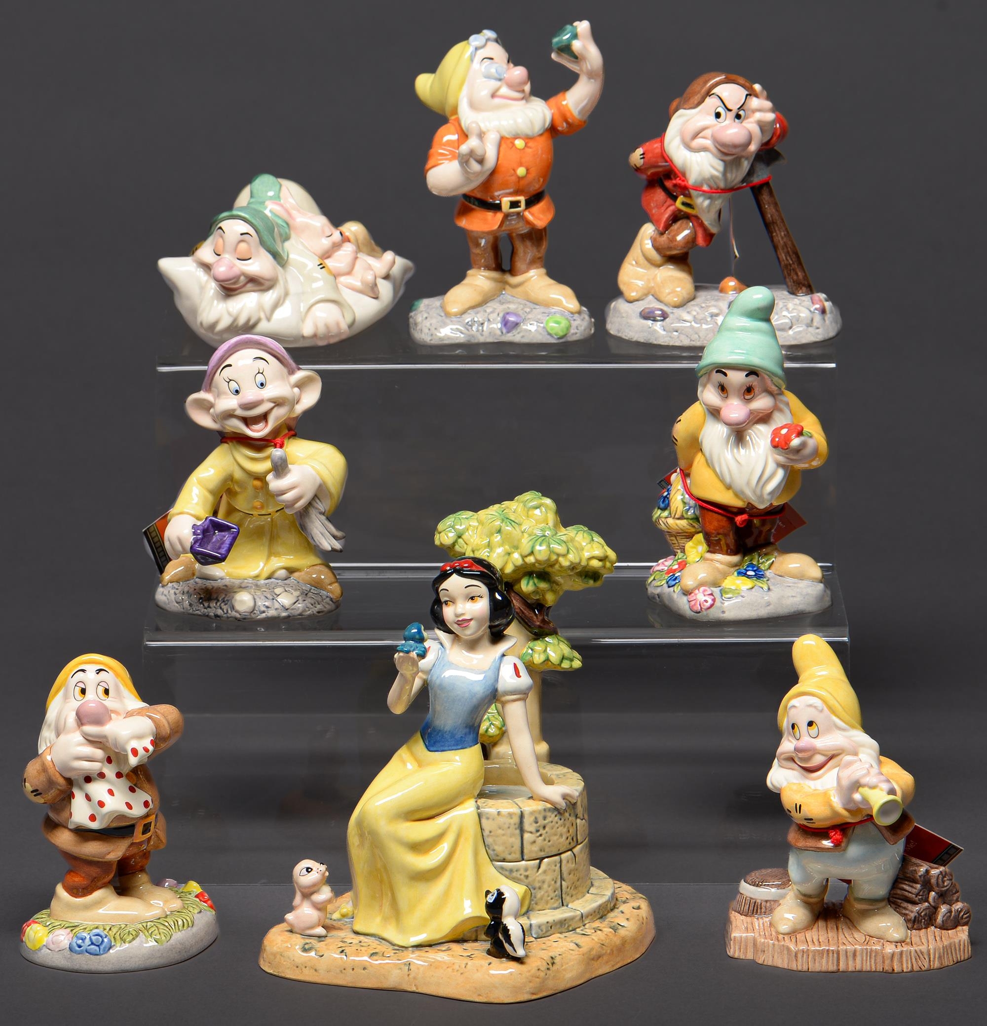 A set of Royal Doulton Disney Showcase figures of Snow White and the Seven Dwarves, Snow White