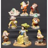 A set of Royal Doulton Disney Showcase figures of Snow White and the Seven Dwarves, Snow White