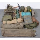 Militaria. Miscellaneous tents, sleeping bags,  rolls, bed, etc, used by the late vendor when