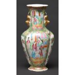 A Chinese Canton famille rose vase, 19th c, with gilt lion dog handles, typically enamelled with