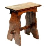 An oak trestle stool, 19th / early 20th c, in Henry VIII style, with pegged stretcher, 56cm h; 27