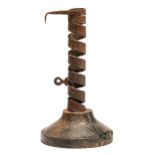 An English or French sheet iron spiral candlestick, 18th c, on turned wood foot, 18cm h Some rust