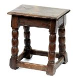 An oak joined stool, early 20th c, possibly incorporating earlier elements, in Charles II style,