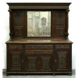 A Victorian oak mirror-back sideboard, c1900, with carved panels and fluted pillars, the lower