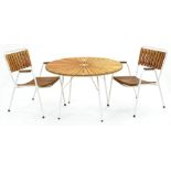 A teak and white painted tubular metal garden table and pair of elbow chairs, c1970, table 64cm h;
