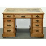 An Edwardian walnut pedestal desk, 72cm h; 62 x 109cm Bleached / faded, splits to top