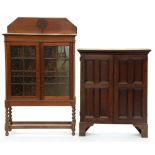 An oak bookcase, early 20th c, with four panel doors, on bracket feet, 110cm h; 26 x 90cm and an oak