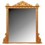 An early Victorian giltwood and composition overmantel mirror, with shell cresting, ball cavetto and