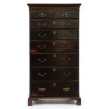 A mahogany tallboy, early 20th c, with blind fret carved cornice and brass handles and