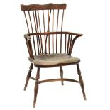 An ash comb back Windsor armchair, Thames Valley or Lincolnshire, first half 19th c, with spindle