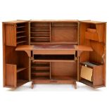 A mid-century modern Newcraft teak 'Home Office', of triptych form with fitted interior and