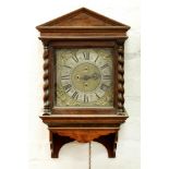 An English walnut thirty hour hooded wall clock, William Brock, dated 1705, the 9" brass dial with