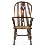 A Victorian ash high back Windsor armchair, North Nottinghamshire, mid 19th c, with turned arm