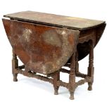 A George II oak gateleg table, on baluster legs, 74cm h; 108 x 143cm hinges rusty, top scratched and