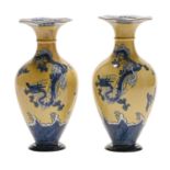 A pair of Wedgwood yellow ground blue printed earthenware dragon vases, 1905,  23cm h, impressed
