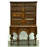 A Queen Anne oak geometric moulded chest on stand, the sides with raised and fielded panel, the