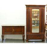 A mahogany wardrobe, J S Henry, London, early 20th c, with blind fret carved detail and a marble