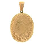 An engraved gold mounted locket, 33mm Slight wear