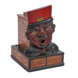 Smoking. A French  carved and painted wood cigarette dispenser in the form of the head of a