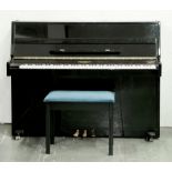 A Regent black lacquer upright piano, late 20th c, three-pedal, 137cm l and a similar music stool (
